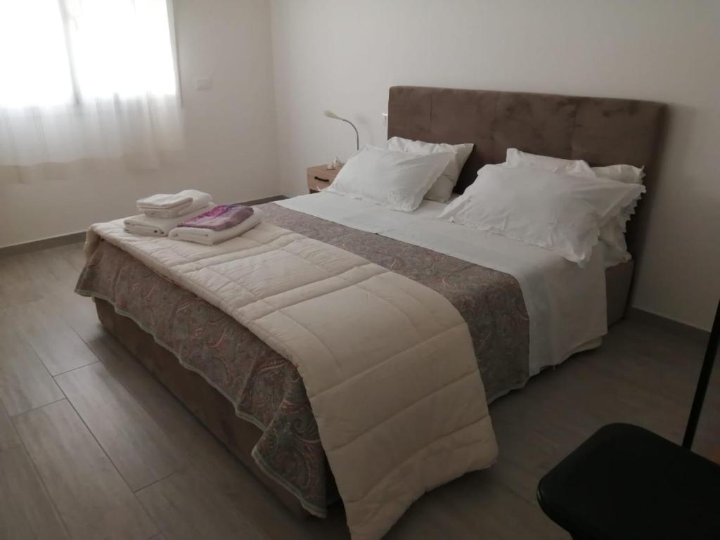 En eller flere senge i et værelse på Suite Petit