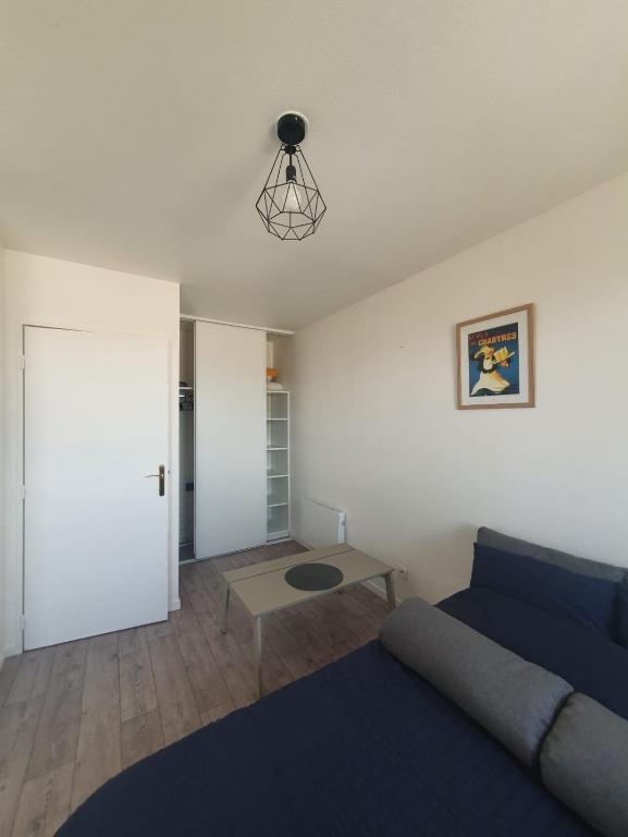 Posezení v ubytování Parenthèse confortable avec balcon et parking