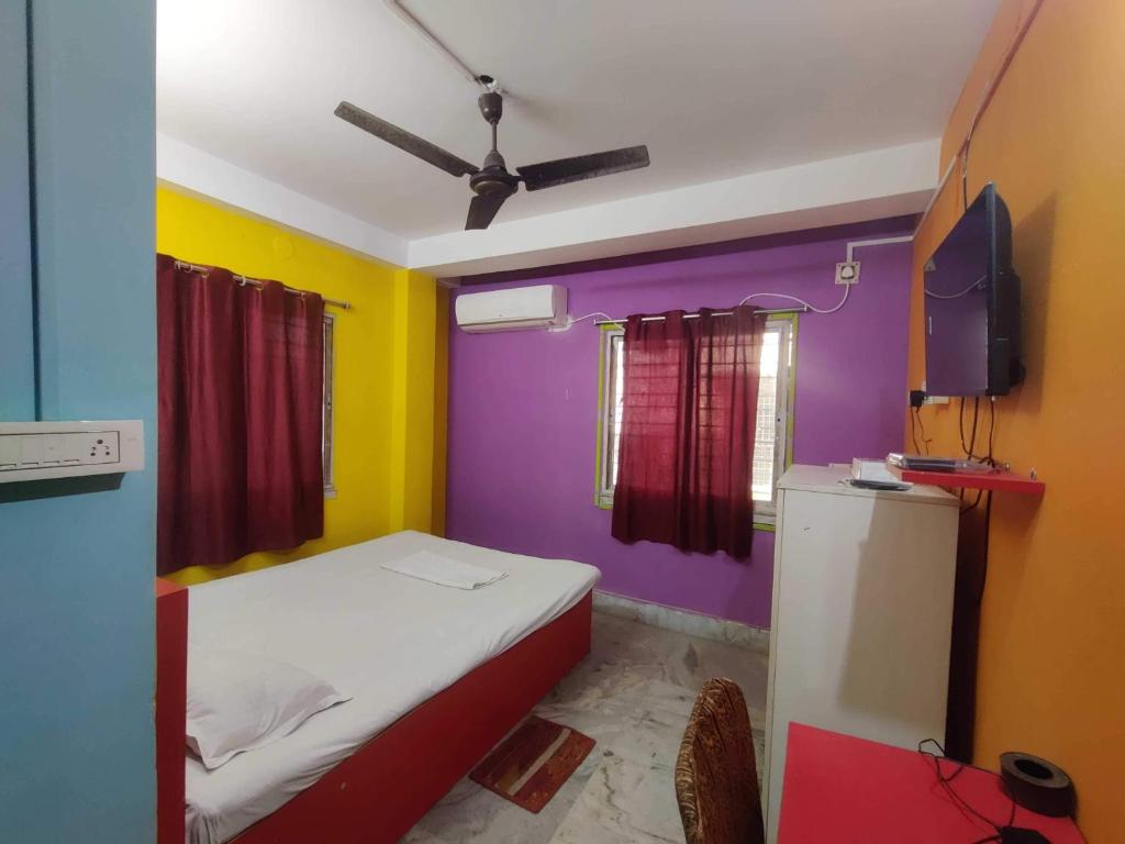 Ένα ή περισσότερα κρεβάτια σε δωμάτιο στο Hotel O Shakuntala Park Bus Terminus Behala