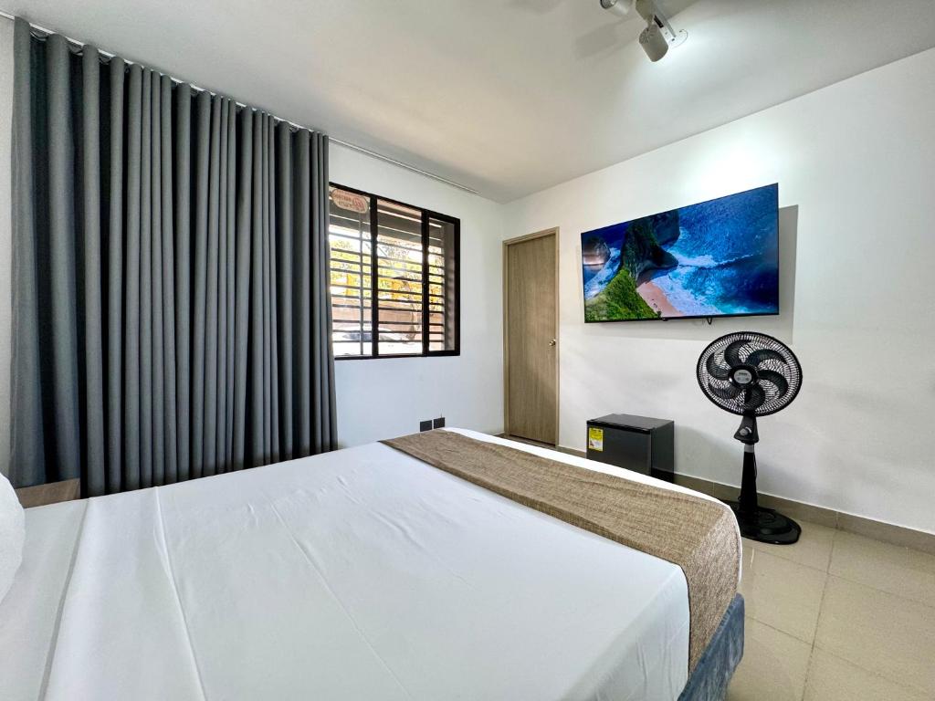 Ένα ή περισσότερα κρεβάτια σε δωμάτιο στο Praga Room Unicentro