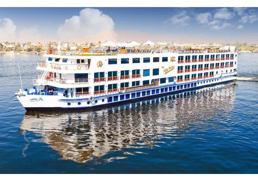 a cruise ship is docked in the water at Nile Cruise Aswan & Luxor & Abu Simbel in Luxor