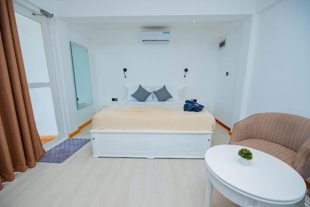 Voodi või voodid majutusasutuse Mamas Hikkaduwa toas