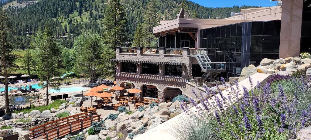 a resort building with a swimming pool and a resort at Dav's Slopeside King Studio -- Resort & Spa at Everline in Olympic Valley