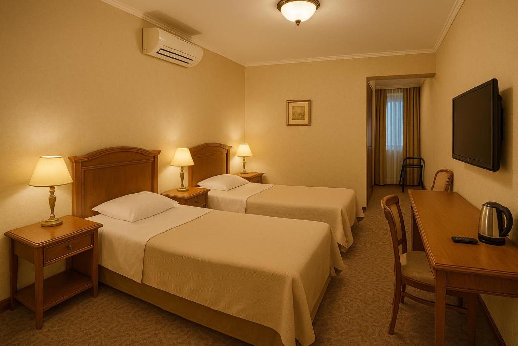 Postel nebo postele na pokoji v ubytování The Sweet Hotel