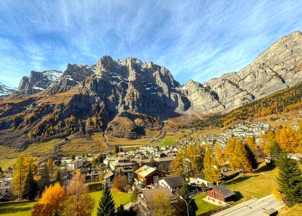 a small town in front of a mountain at Retro Alpine Studio - Terrace with Mountain View in Leukerbad