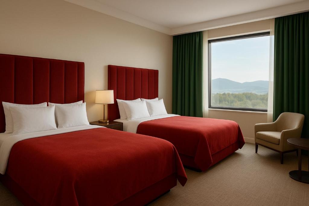 Postel nebo postele na pokoji v ubytování Khatai Deluxe Hotel