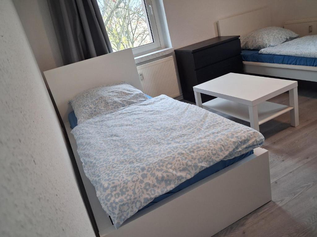 Postel nebo postele na pokoji v ubytování Crew Quartier ALL-INCLUSIVE Serviced Apartments ideal für Monteure 3 Schlafzimmer