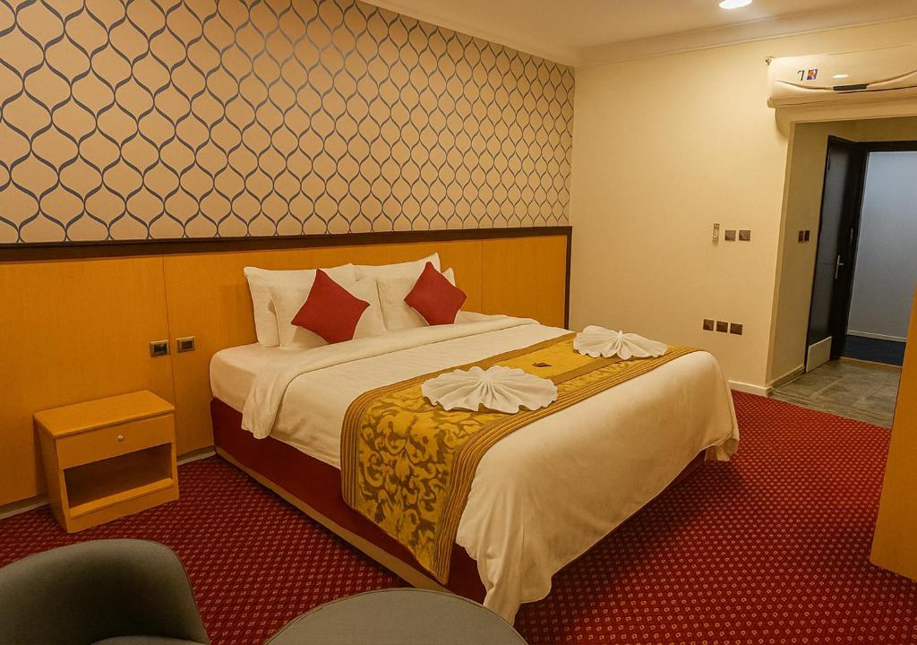 Ένα ή περισσότερα κρεβάτια σε δωμάτιο στο فندق رفاق مكة