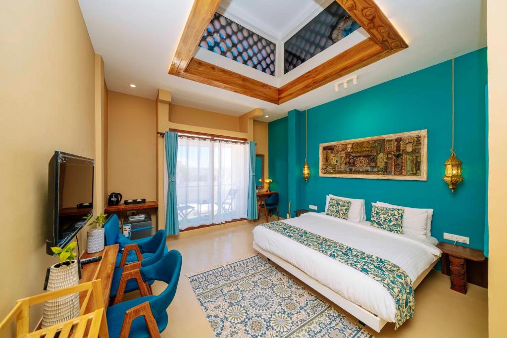 Ένα ή περισσότερα κρεβάτια σε δωμάτιο στο The Swahili Plaza