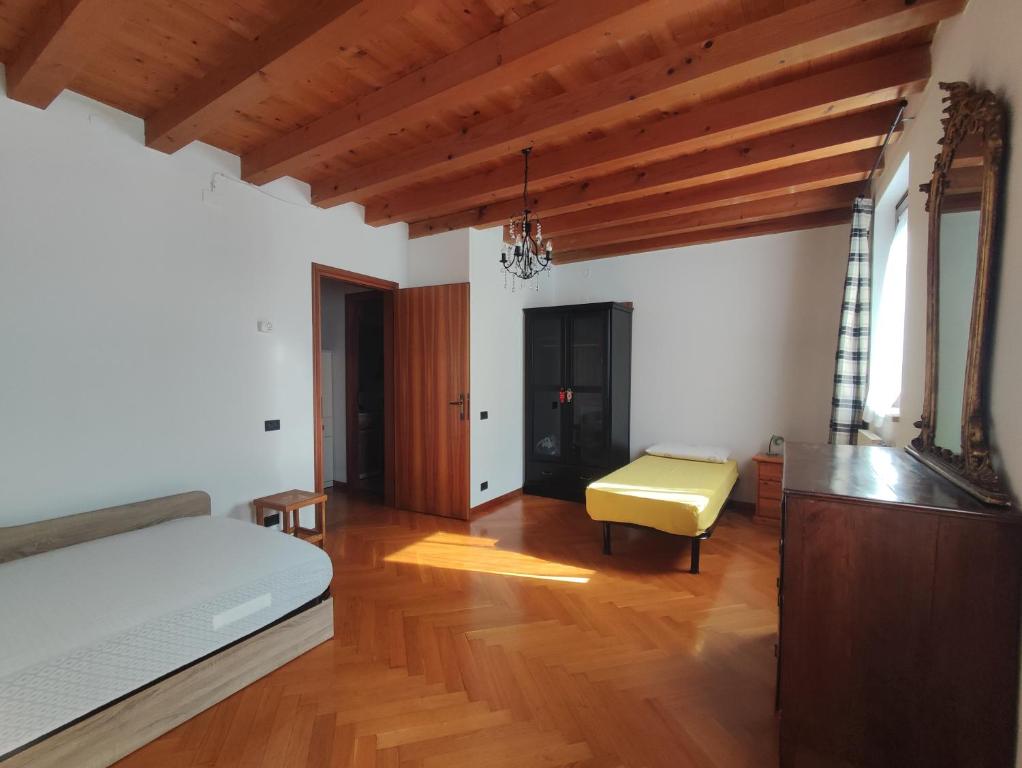 Postel nebo postele na pokoji v ubytování Torre Cà Emo, CasAmarti