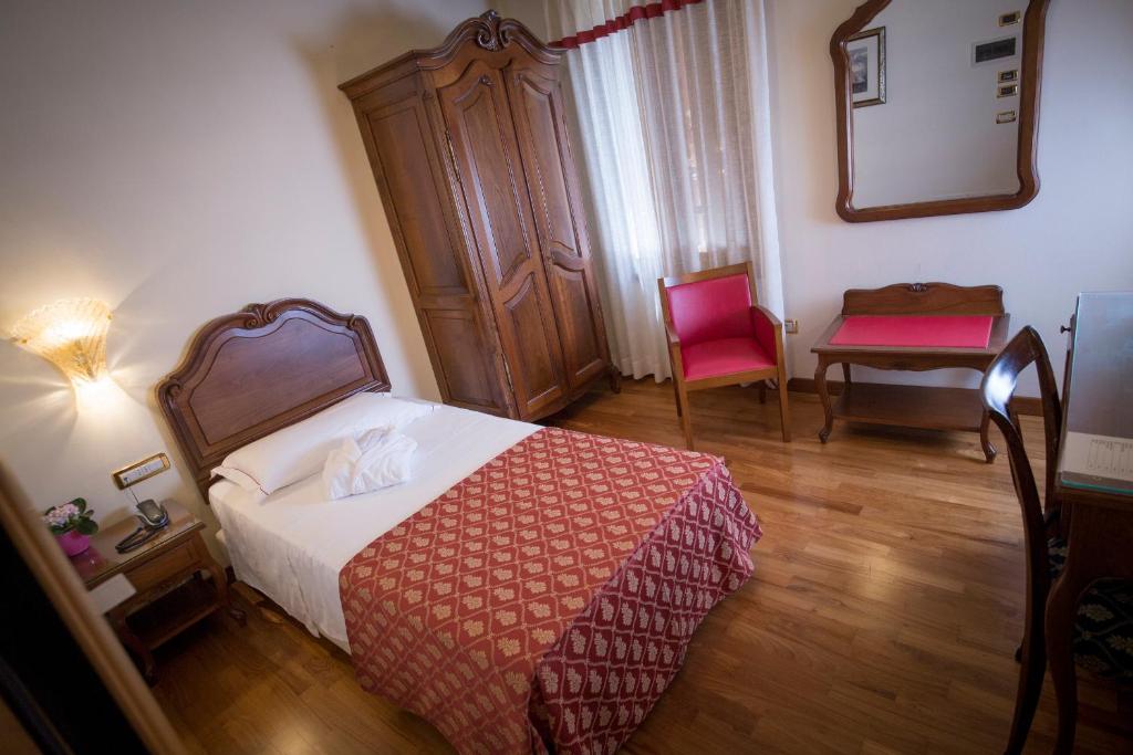 Postel nebo postele na pokoji v ubytování Hotel Spessotto