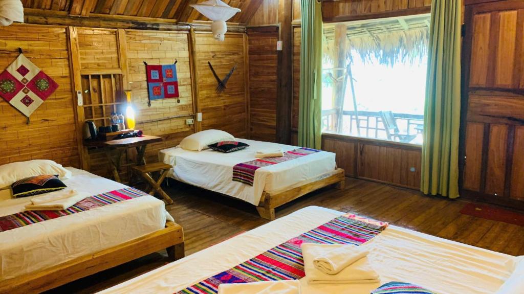 Ένα ή περισσότερα κρεβάτια σε δωμάτιο στο Pu Luong Bản