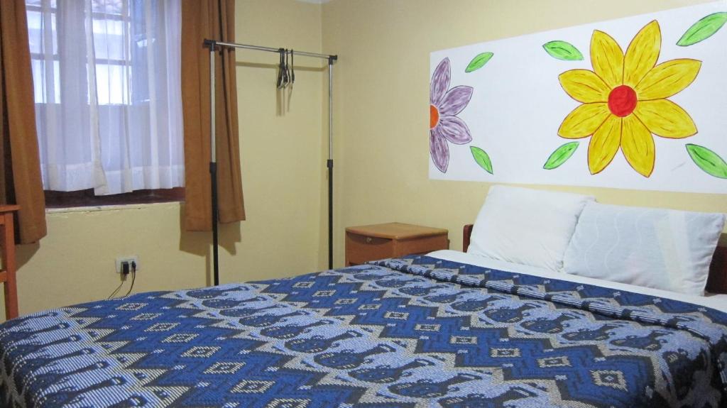 Ένα ή περισσότερα κρεβάτια σε δωμάτιο στο Garden Inn 488