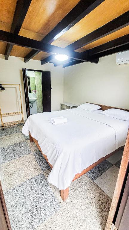 Postel nebo postele na pokoji v ubytování Capung Guesthouse