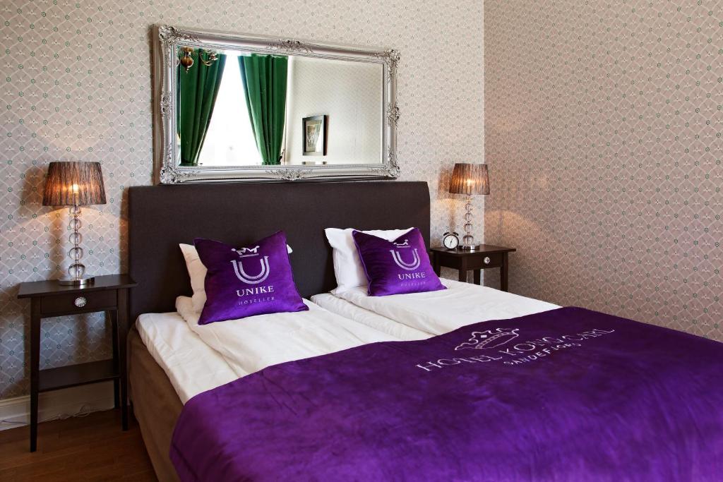 Postel nebo postele na pokoji v ubytování Hotel Kong Carl - Unike Hoteller