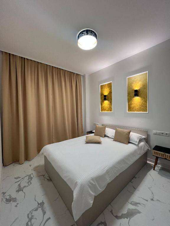 Postel nebo postele na pokoji v ubytování Eden home Sibiu