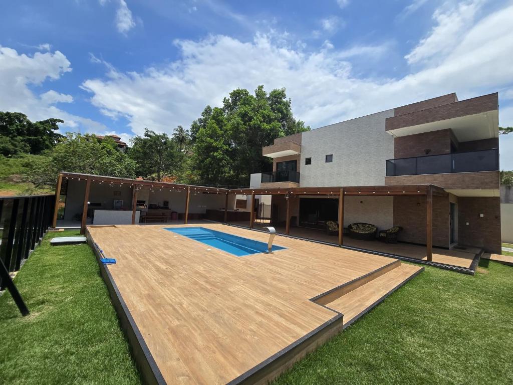 Bazén v ubytování Casa em condomínio Guarapari ES nebo v jeho okolí