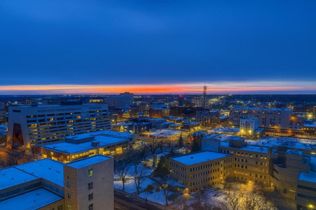 an aerial view of a city at night at 2BR Downtown apt Amazing View Free Parking & Gym in Saskatoon