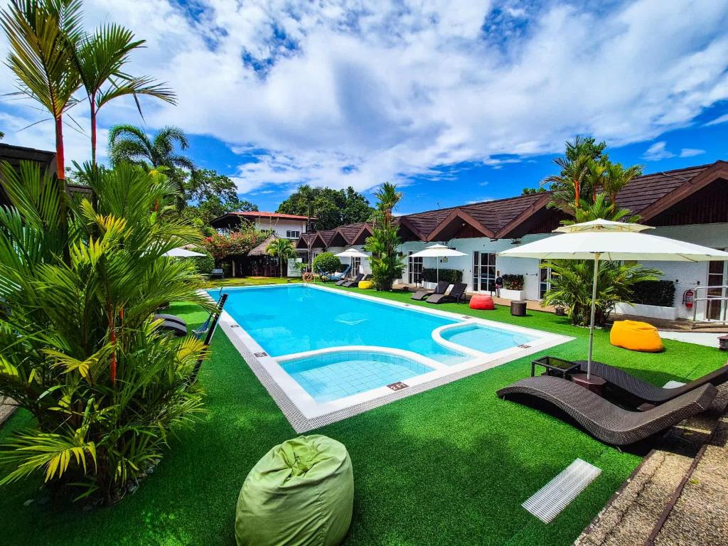 an image of the backyard of a house with a swimming pool at SunzEn Palawan, Resort in Coron