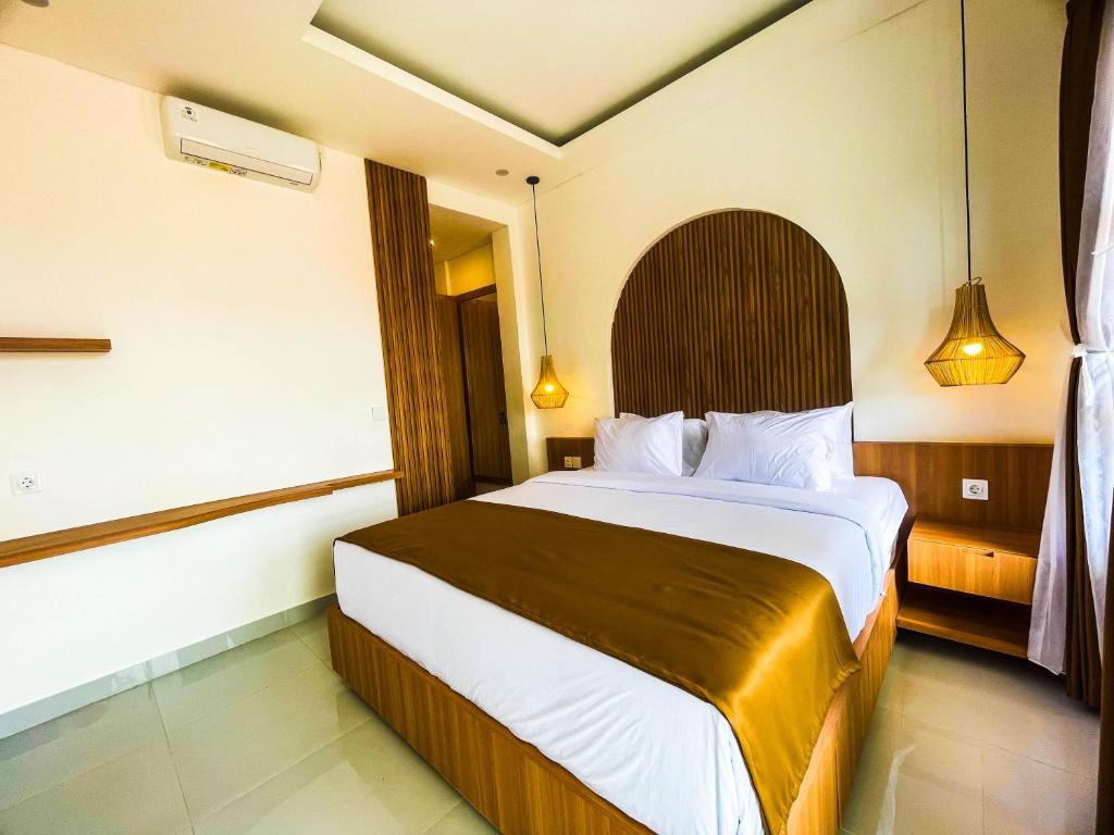 Postel nebo postele na pokoji v ubytování Sundari Guesthouse Pererenan