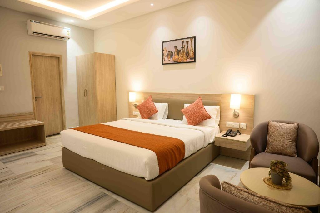 Ένα ή περισσότερα κρεβάτια σε δωμάτιο στο Poonam Aayati