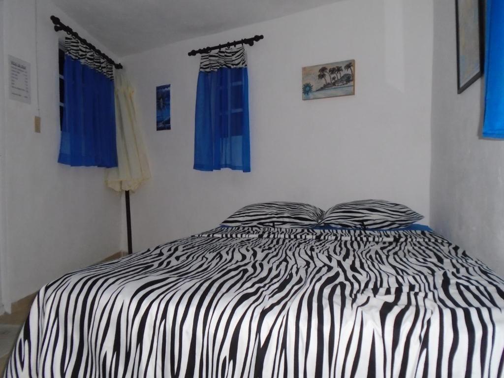 Postel nebo postele na pokoji v ubytování Guesthouse Villa La Isla