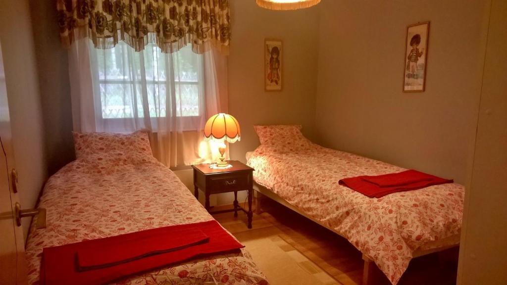 Postel nebo postele na pokoji v ubytování Villa Lovisa