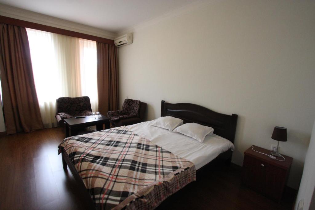 Postel nebo postele na pokoji v ubytování Hotel Lux