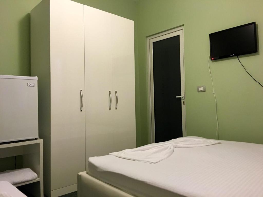 Postel nebo postele na pokoji v ubytování British Hotel