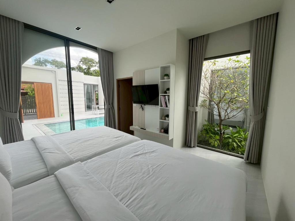 Postel nebo postele na pokoji v ubytování Jasmine Pool Villa