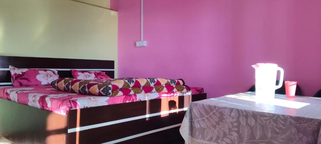 Ένα ή περισσότερα κρεβάτια σε δωμάτιο στο Patwal Home Stay