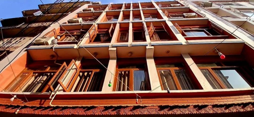 a tall building with many windows on it at Hotel Silver Jubilee in Kathmandu