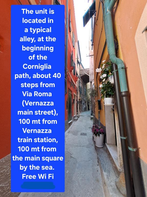 a sign on the side of a street next to a building at Le Stanze del Barbara in Vernazza