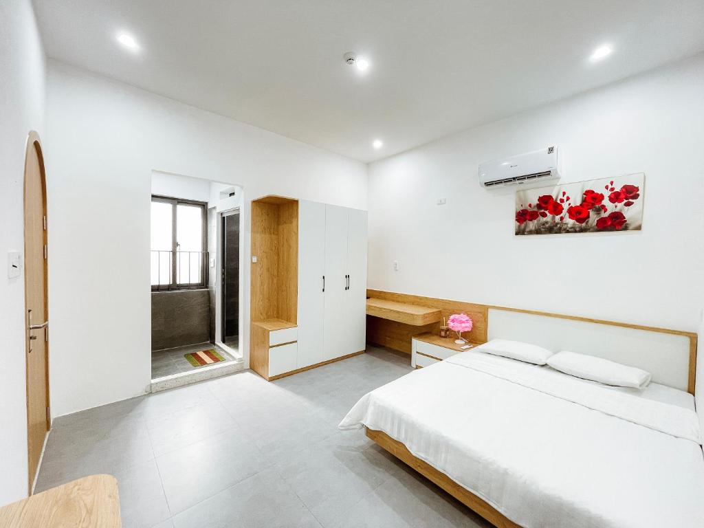 Un pat sau paturi într-o cameră la Quy Nhơn - KTK Homestay