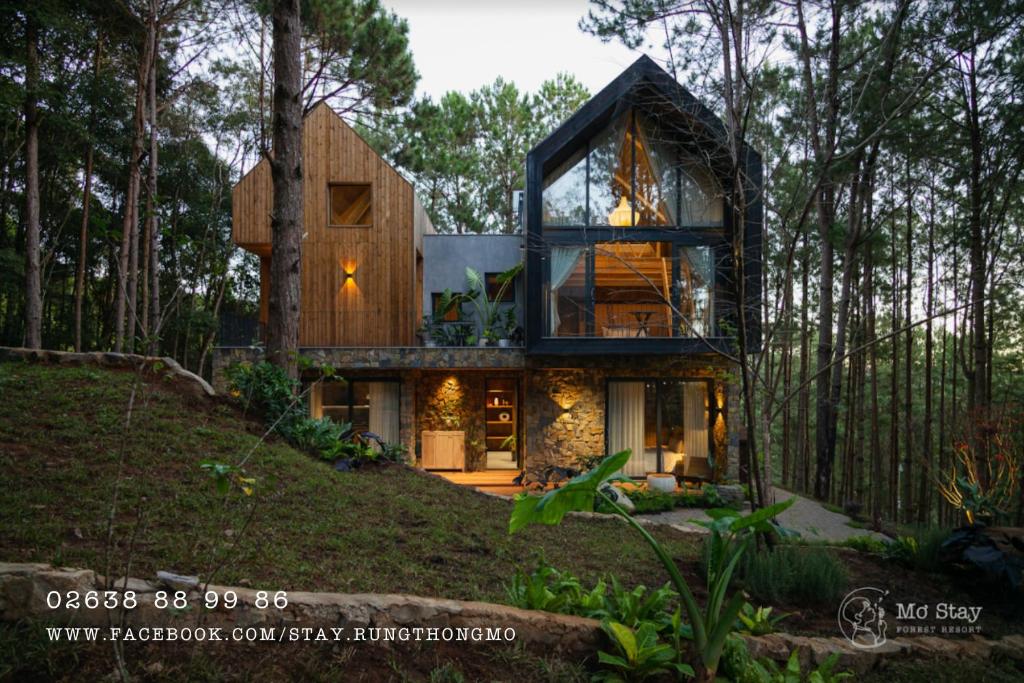 a house in the middle of a forest at Mơ Stay - Forest Resort in Da Lat