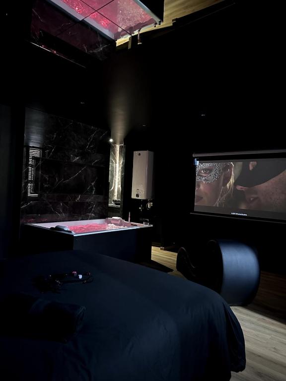 Ένα ή περισσότερα κρεβάτια σε δωμάτιο στο Cinquante Nuances Ponotes