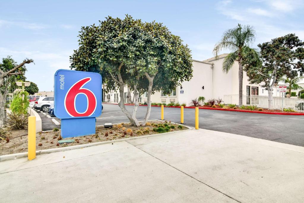 a sign in front of a building at Motel 6-Carson, CA in Carson
