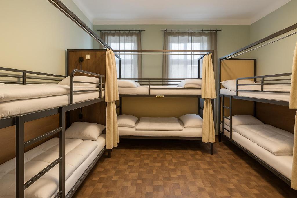 a group of bunk beds in a room at Best Spot Hostel in Prague