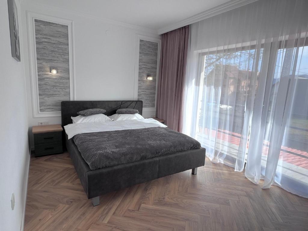 Postel nebo postele na pokoji v ubytování Casa Cențiu II