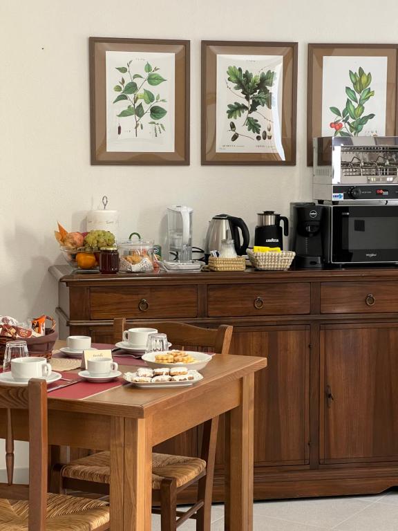 a kitchen with a table with food on it at Corte 'e Susu - Domo Experience in Ortueri