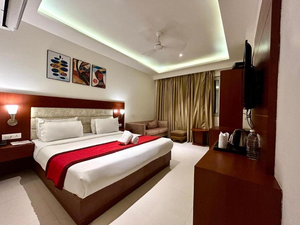 Ένα ή περισσότερα κρεβάτια σε δωμάτιο στο Hotel Z Suites- Free Airport Pickup