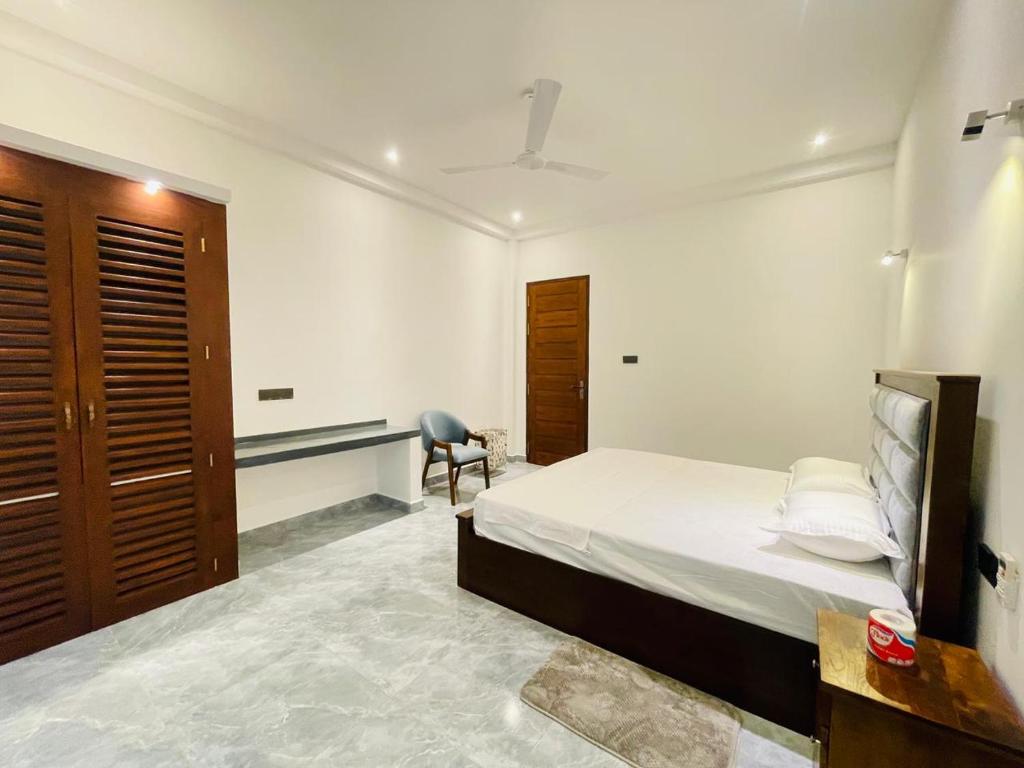 Postel nebo postele na pokoji v ubytování Harmon Weligama