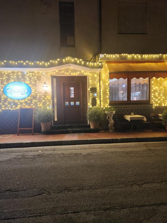 a restaurant with lights on the side of a building at Albergo Gemma in Roseto degli Abruzzi