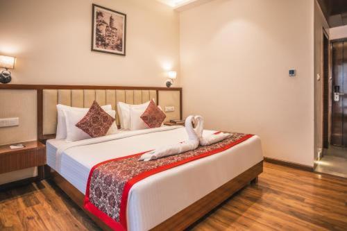 Ένα ή περισσότερα κρεβάτια σε δωμάτιο στο Hotel The Gross Infinity Near Delhi Airport