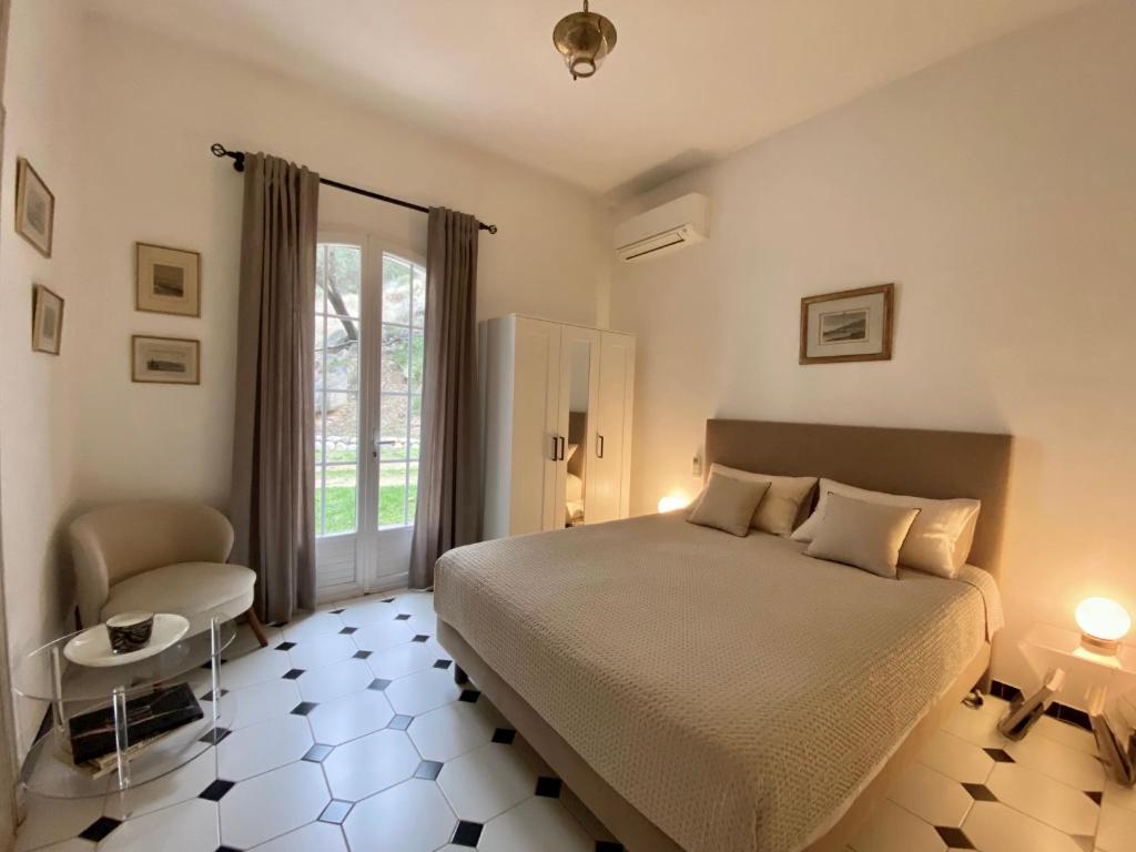 Postel nebo postele na pokoji v ubytování Villa les Palmiers