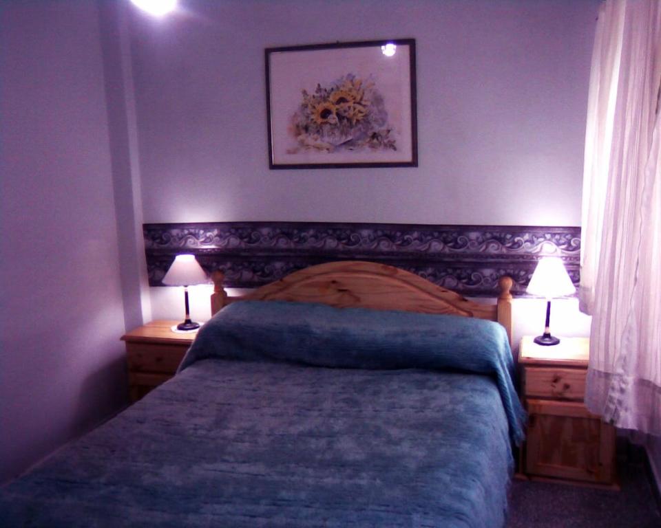 En eller flere senge i et værelse på Departamento 2 ambientes PB a metros del mar