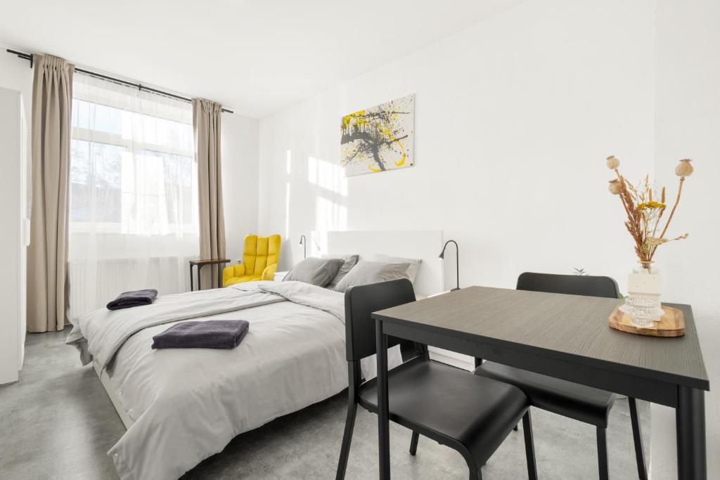 Ένα ή περισσότερα κρεβάτια σε δωμάτιο στο SPECTRA Rooms