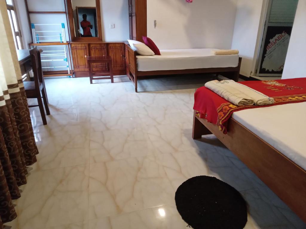 Ένα ή περισσότερα κρεβάτια σε δωμάτιο στο Mahagedara