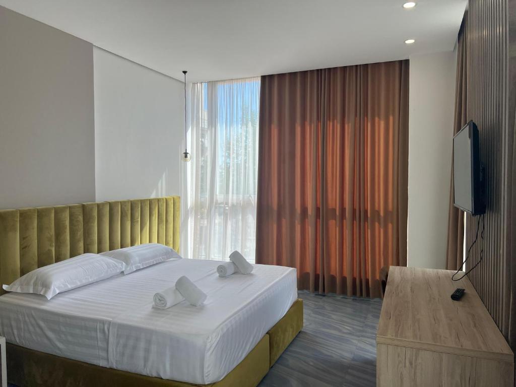 Postel nebo postele na pokoji v ubytování Ajsel Hotel