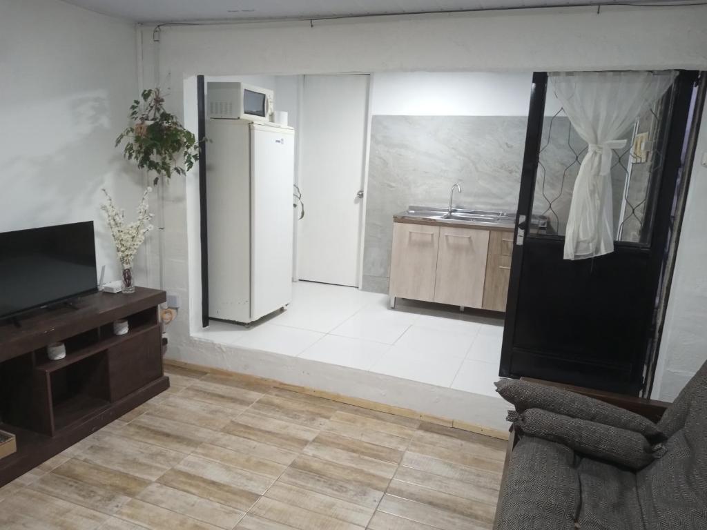 TV a/nebo společenská místnost v ubytování Temporary accommodation in Mercedes Soriano